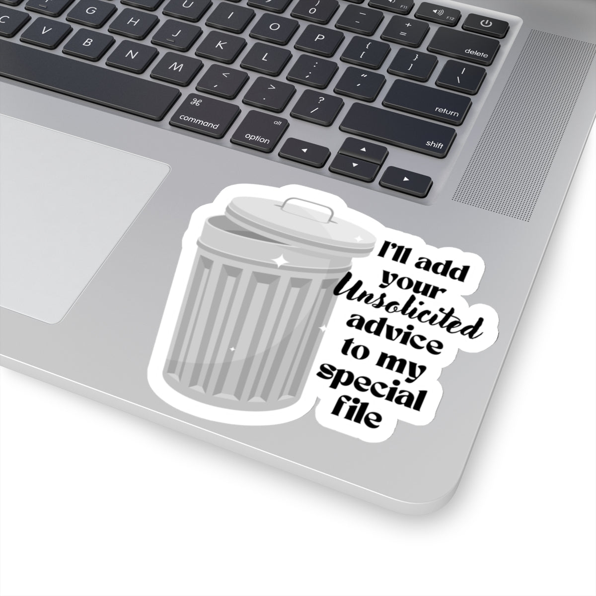 4 inch sticker of a trash can stuck on a laptop
