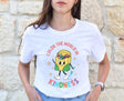 Teacher wearing white retro crayon box character kindness shirt
