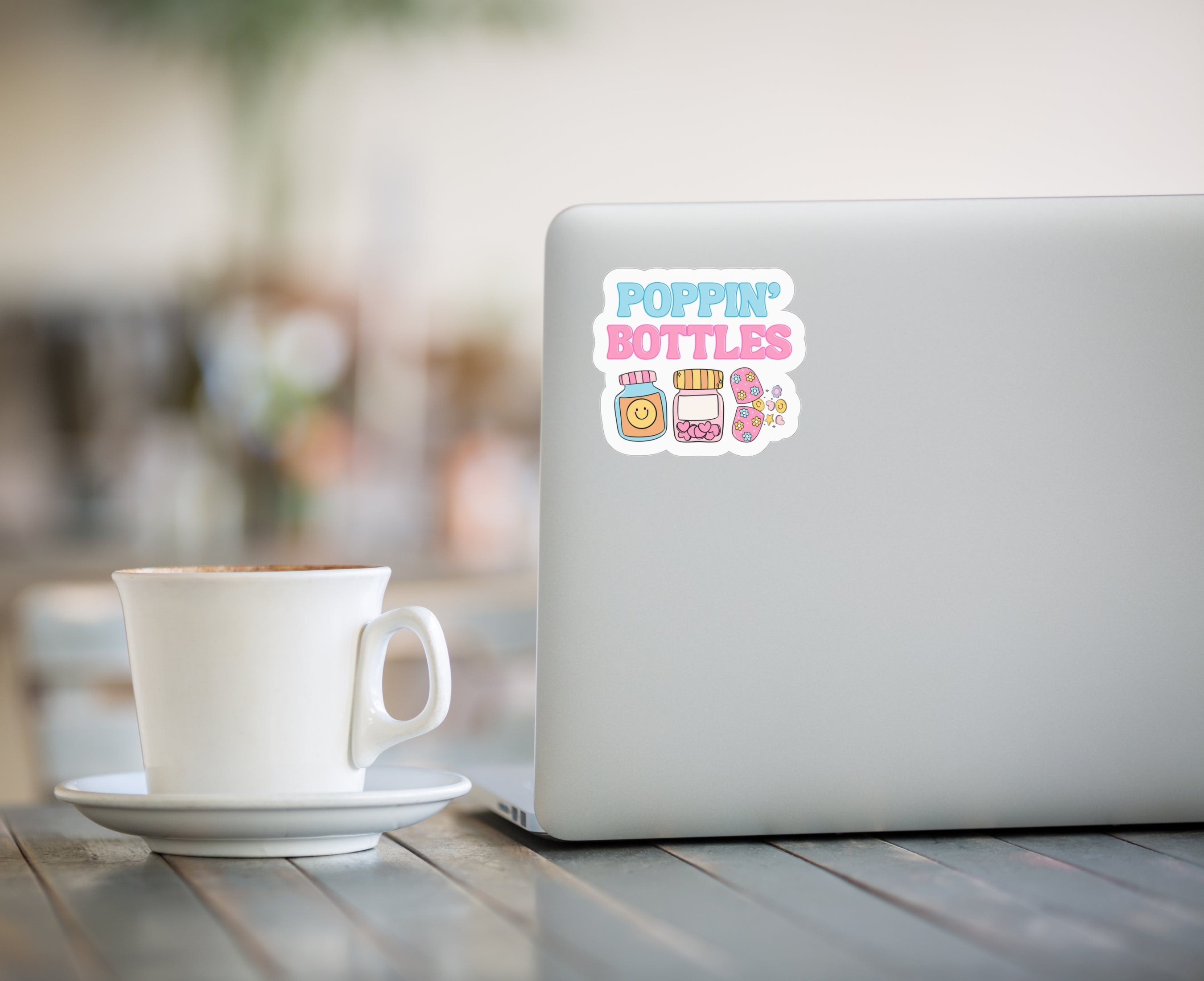 Poppin' Bottles sticker of pill bottles on laptop