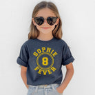 Child wearing a blue t-shirt with 'Sophie 8 Fever' text, heart-shaped sunglasses, and light blue jeans against a white background.