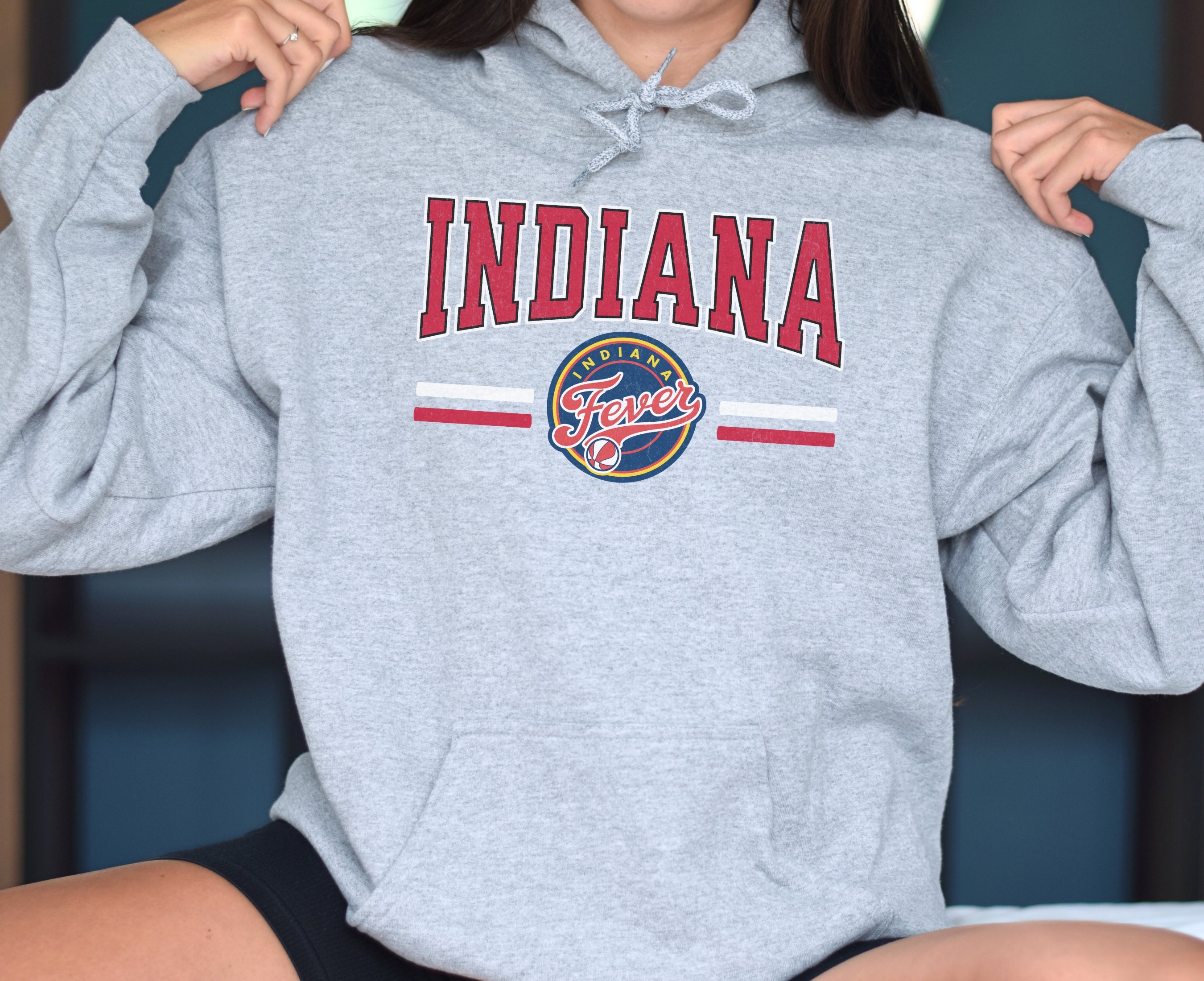 Woman wearing athletic heather Indiana Fever Hoodie Sweatshirt