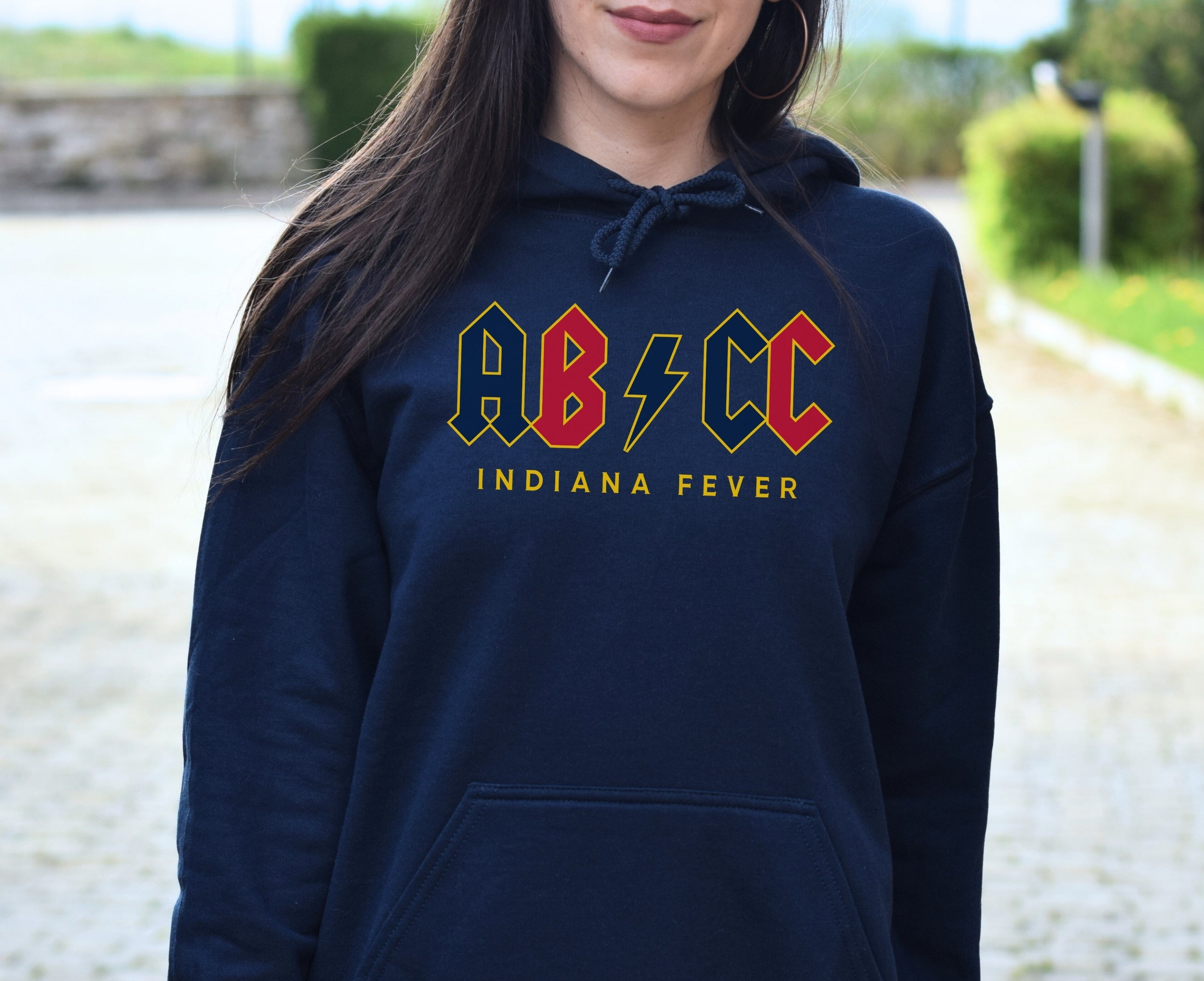 Girl wearing navy ABCC hoodie
