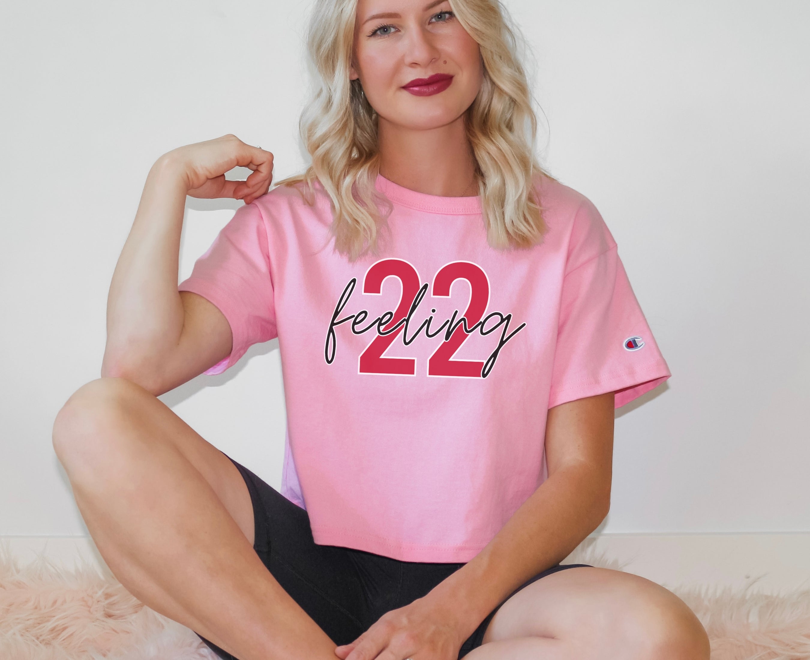 Girl wearing feeling 22 crop top in pink candy
