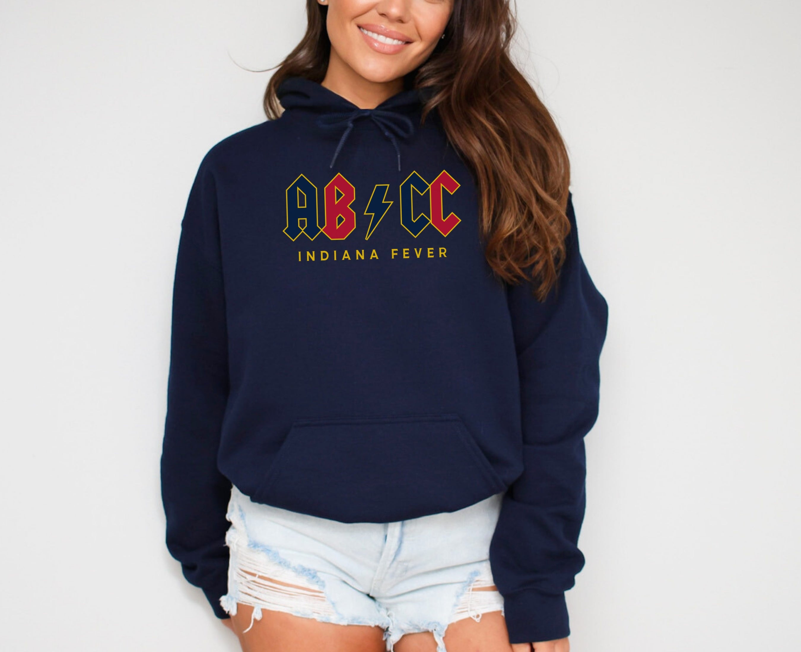 Girl wearing navy ABCC hoodie