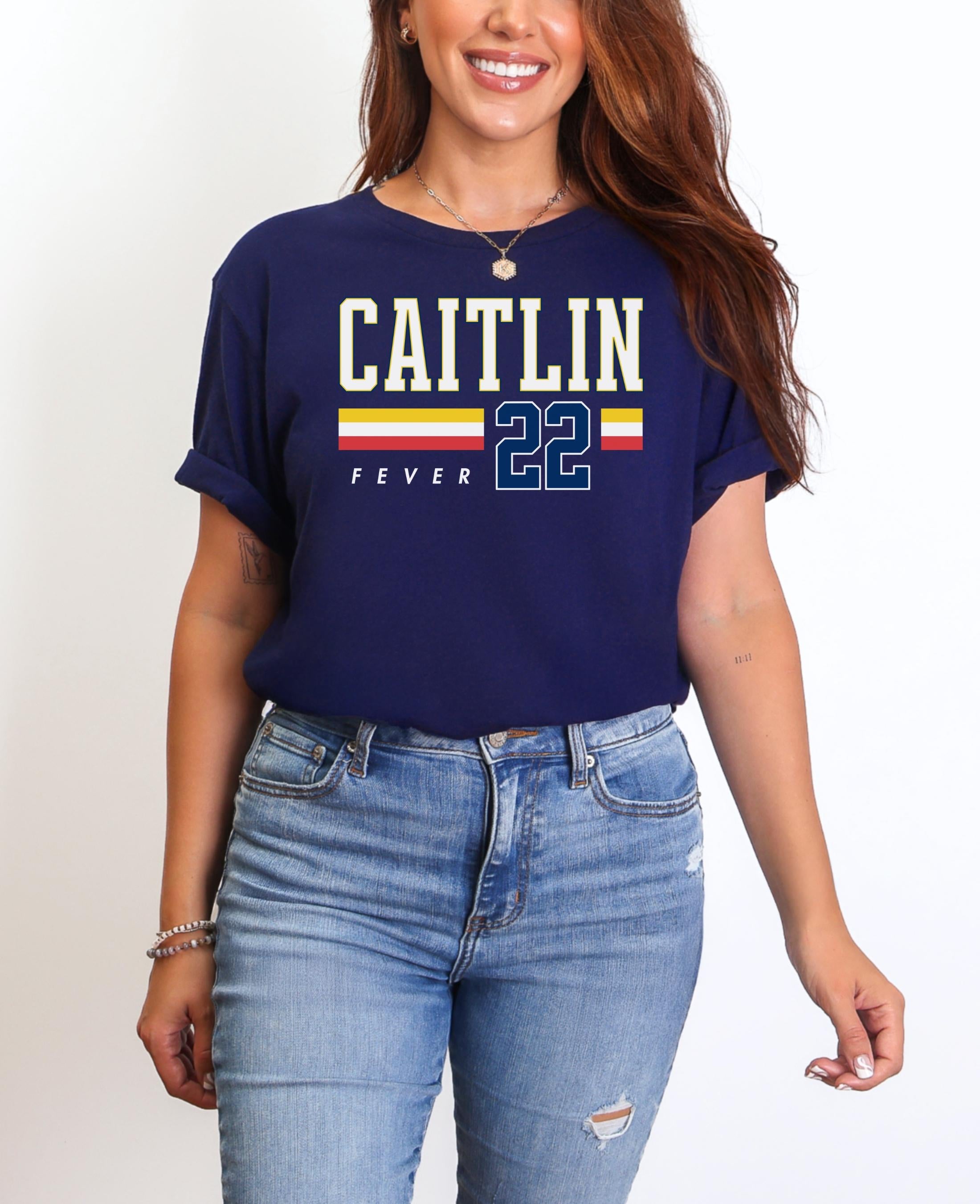 Person wearing t-shirt with 'CAITLIN FEVER' printed on it