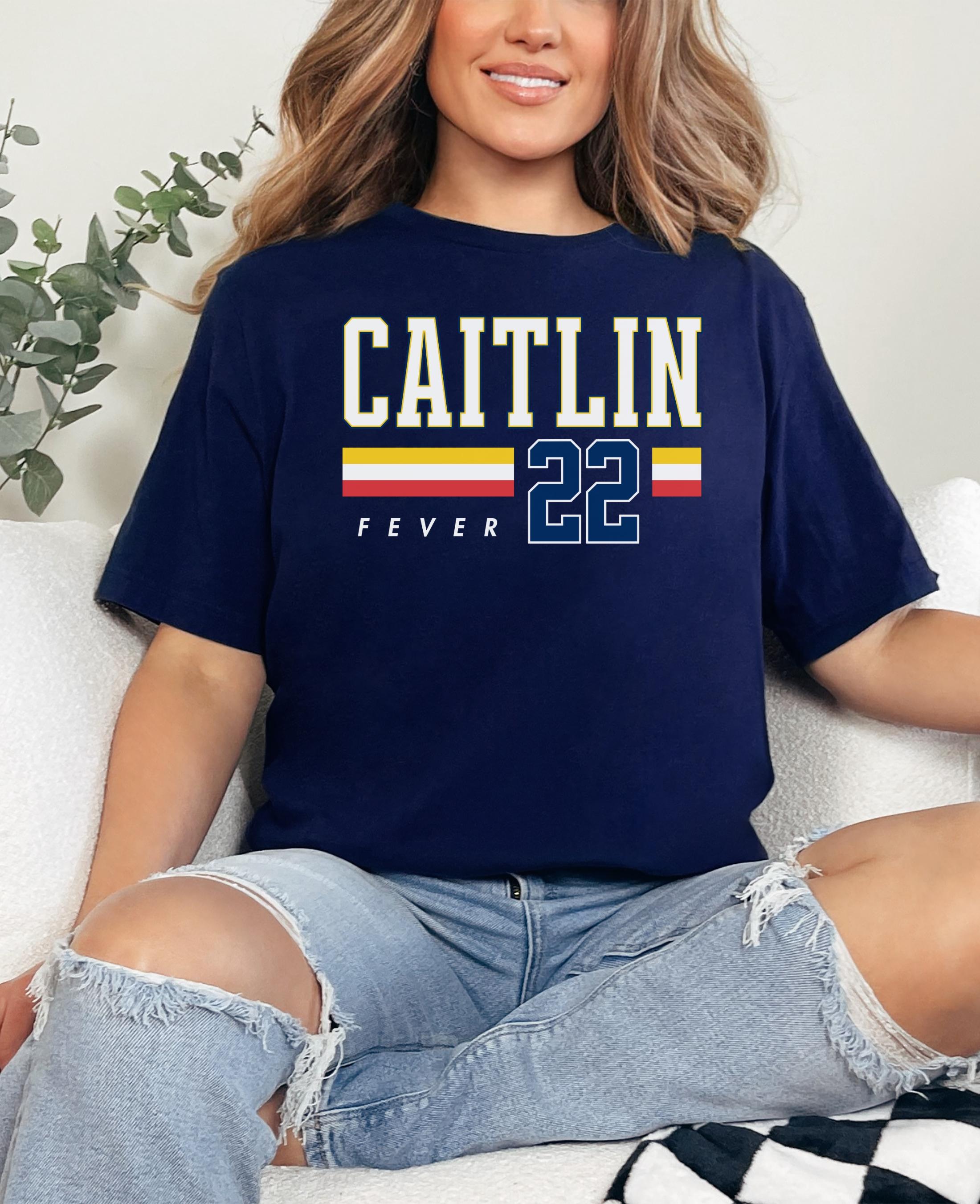Person wearing t-shirt with 'CAITLIN FEVER' printed on it