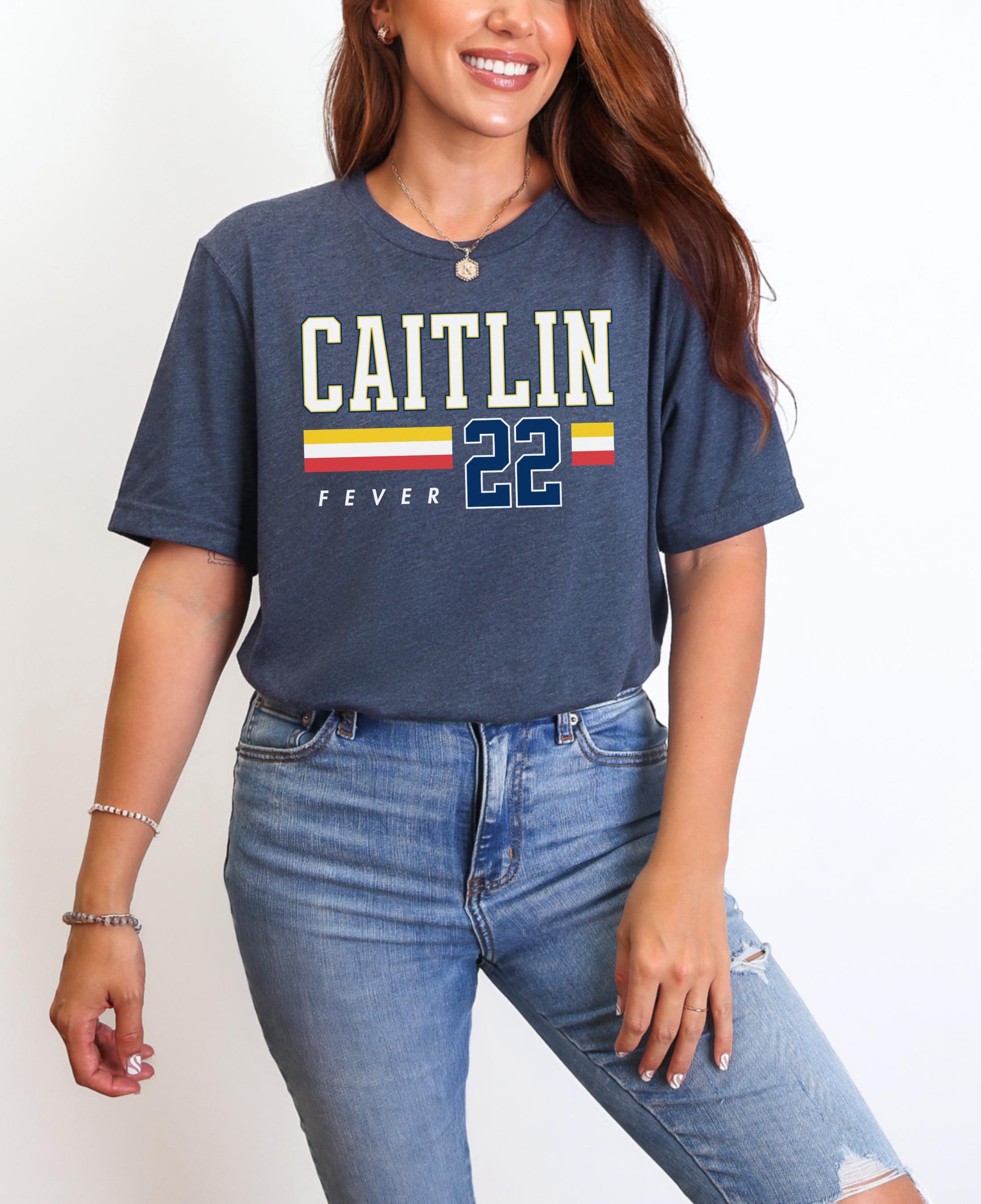 Person wearing t-shirt with 'CAITLIN FEVER' printed on it