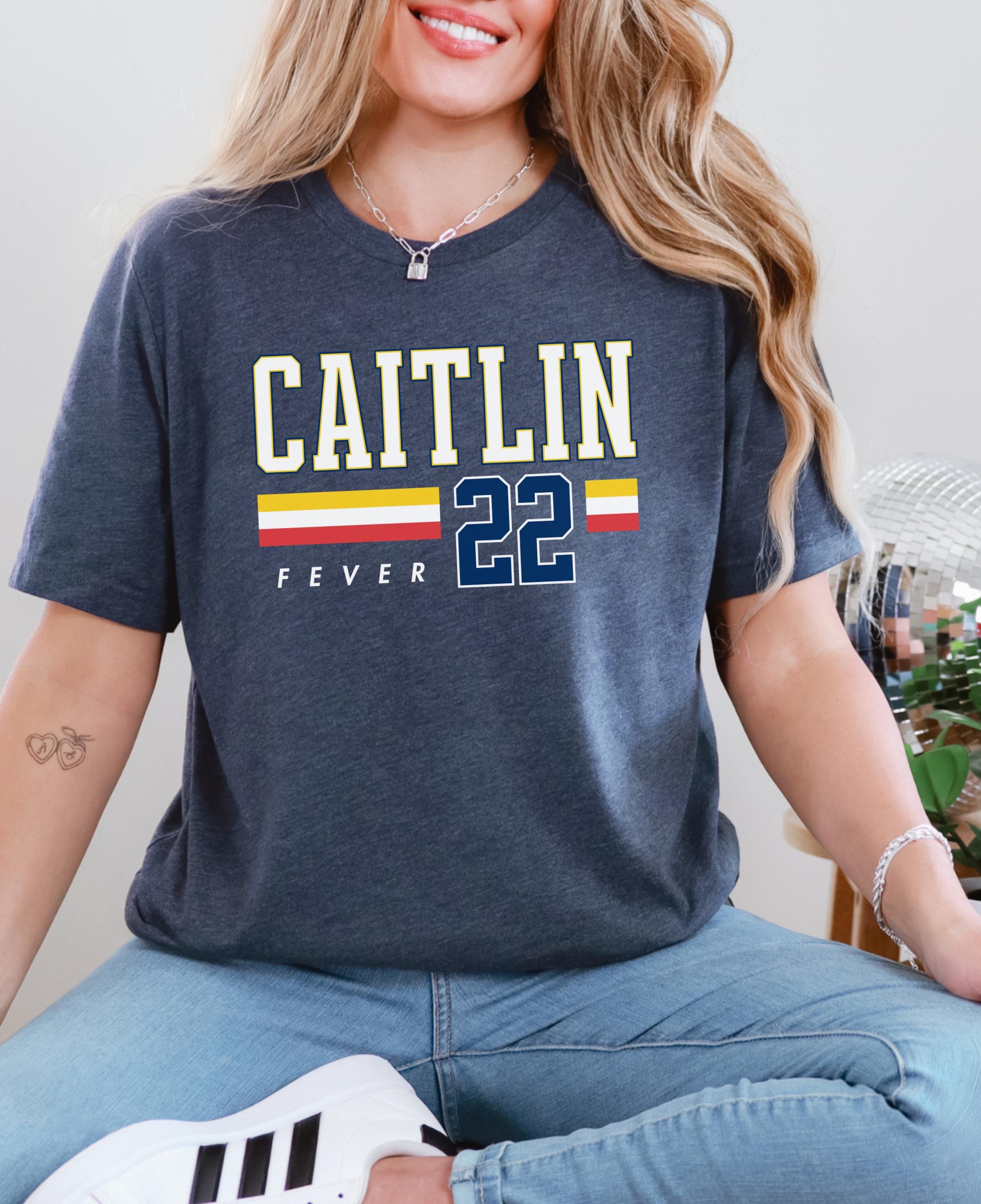 Person wearing t-shirt with 'CAITLIN FEVER' printed on it