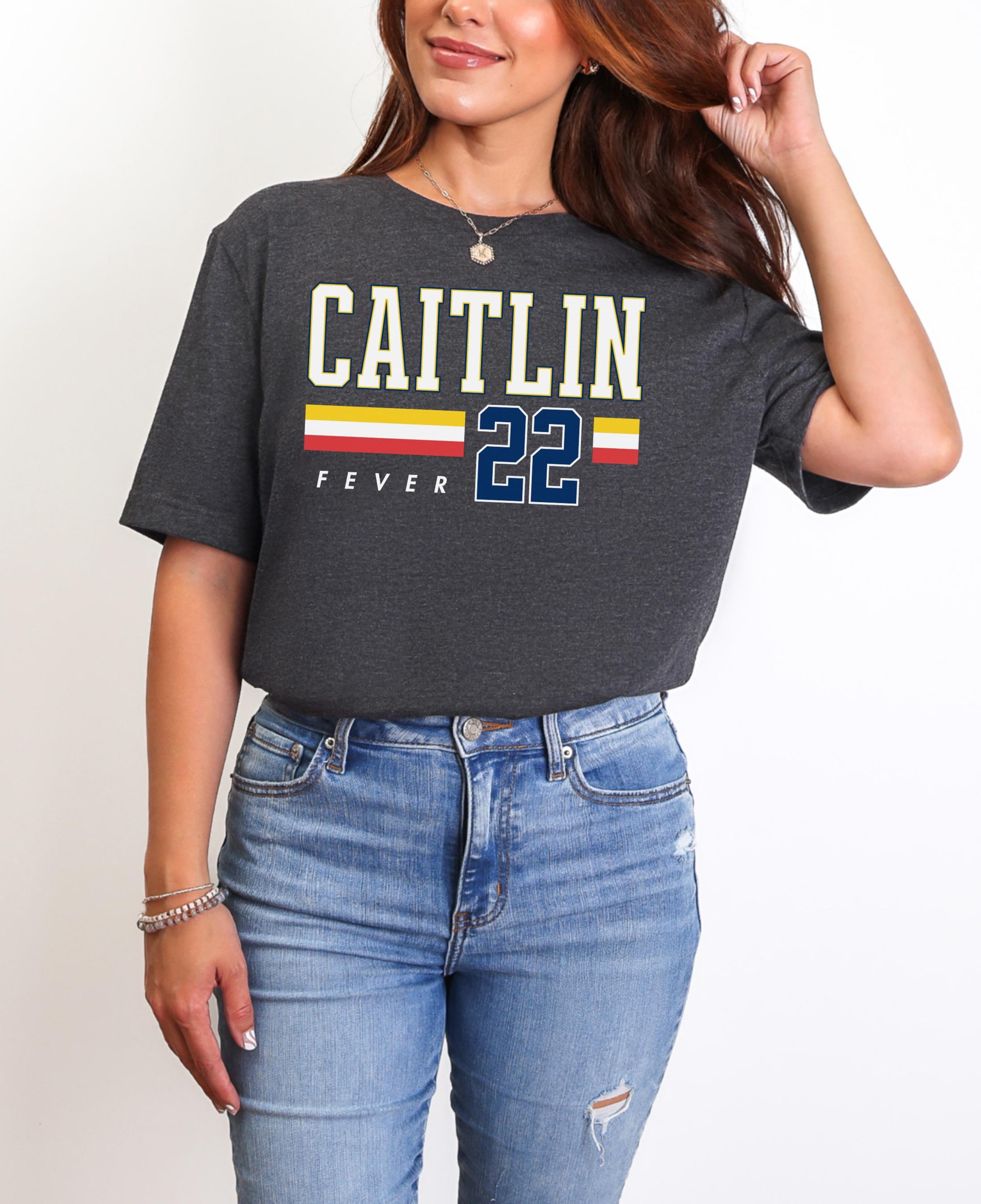 Person wearing t-shirt with 'CAITLIN FEVER' printed on it