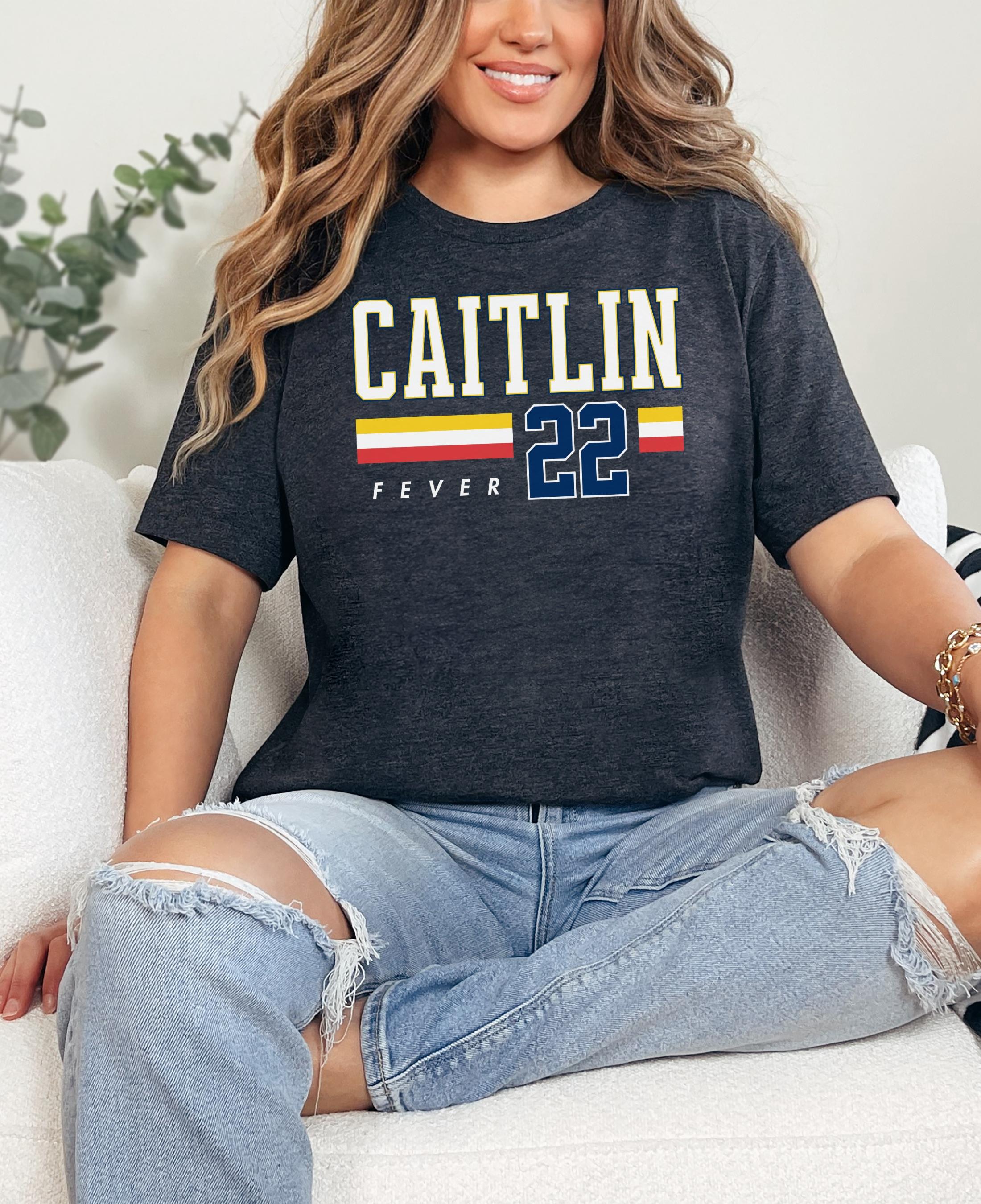 Person wearing t-shirt with 'CAITLIN FEVER' printed on it