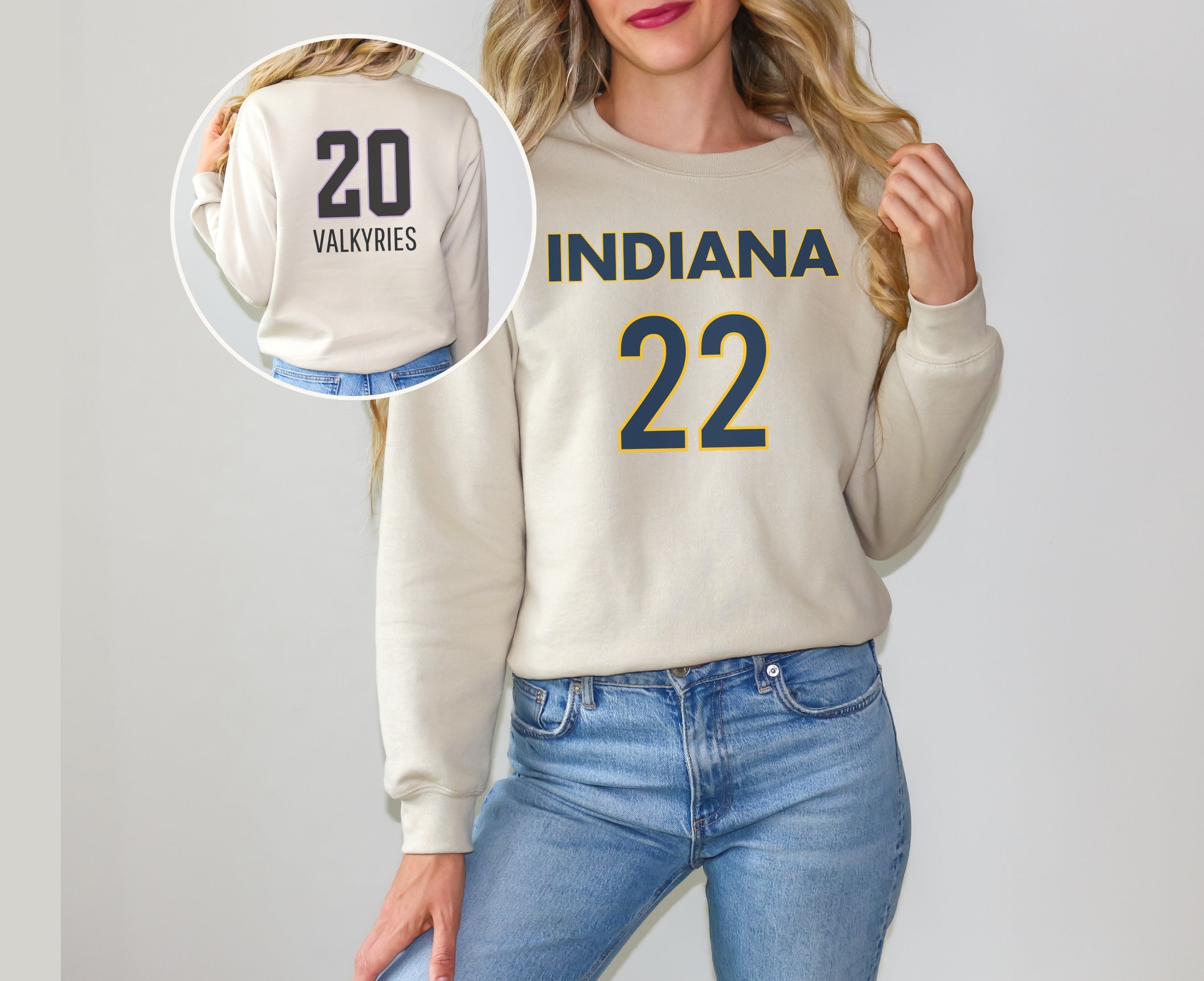 Girl wearing sand sweatshirt with Indiana 22 on front and Valkyries 20 on back