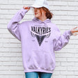 Person wearing a lavender hoodie with 'Golden State Valkyries' text and design, standing against a white brick wall.