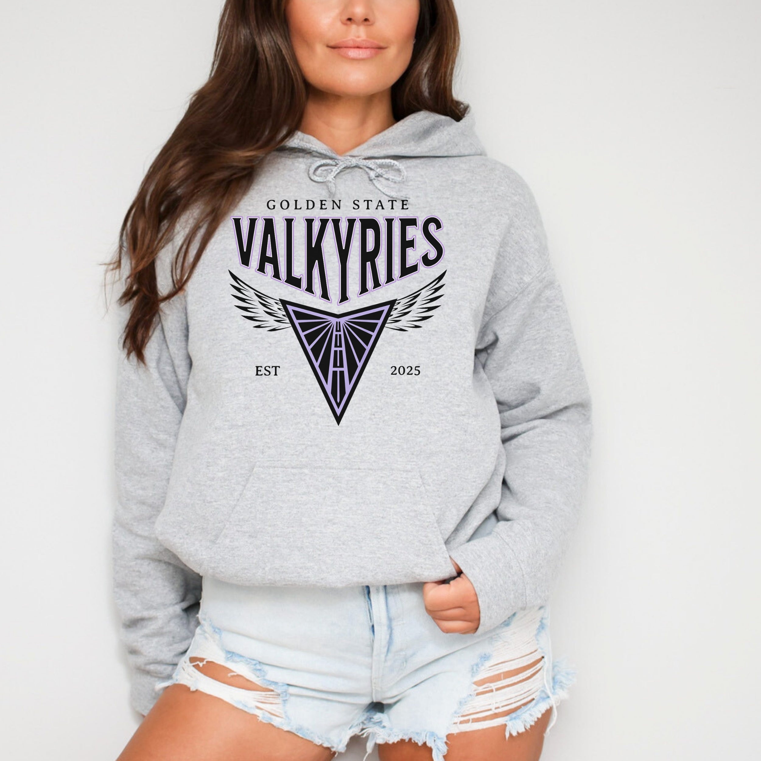 Person wearing a gray hoodie with 'Golden State Valkyries' logo on a plain background