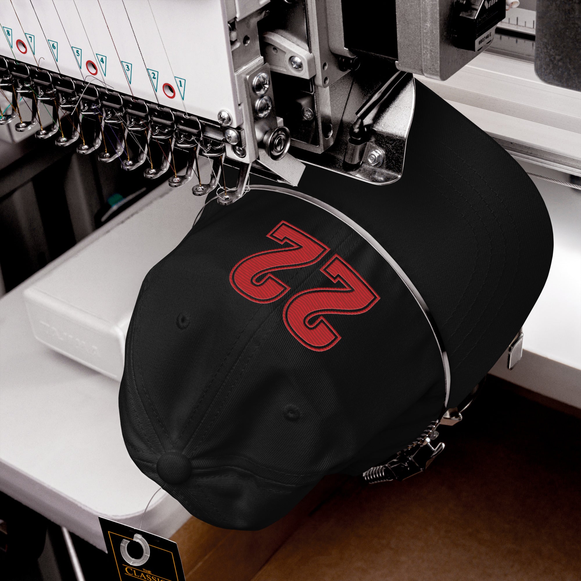 Black Caitlin Clark hat being embroidered with number 22